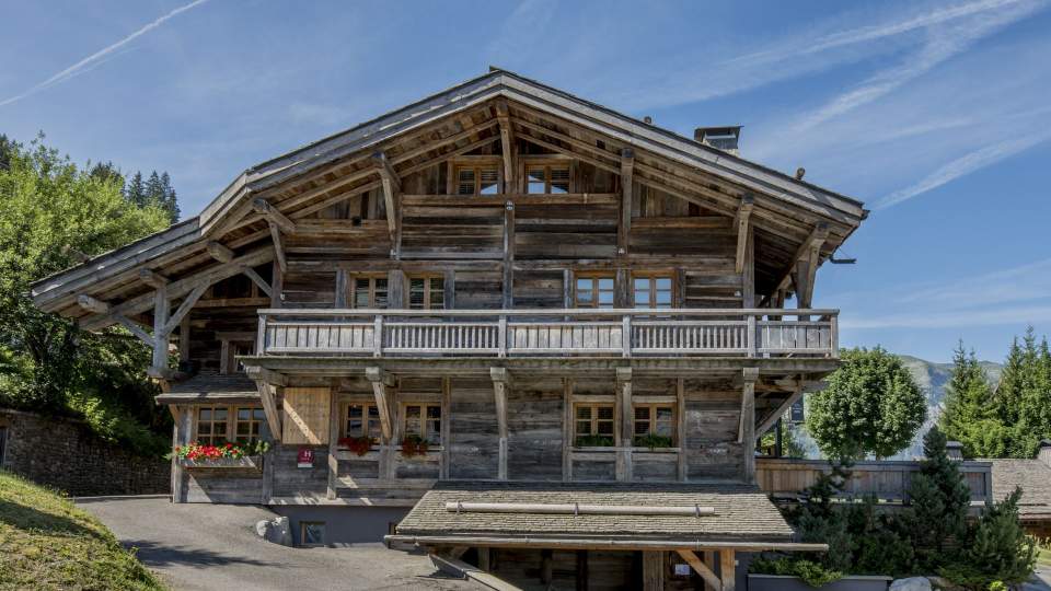 Chalet in the snow, hotel located at the foot slopes in french alps, grand massif